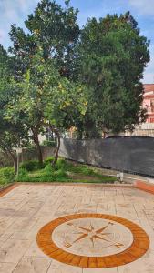 a clock on the ground in a park at Bedrock in Salerno