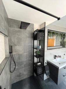 a bathroom with a sink and a shower at NE1 Luxury City Centre Apartment in Newcastle upon Tyne