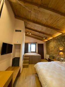 A bed or beds in a room at Irene's Resort