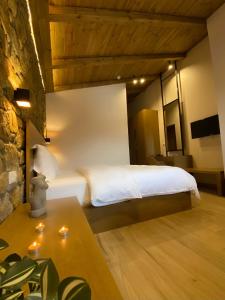 A bed or beds in a room at Irene's Resort