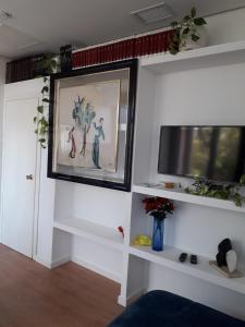 TV a/nebo společenská místnost v ubytování Apartamento turístico Jardines de Asura