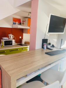 a desk with a computer on top of it at Hostel OT in Split