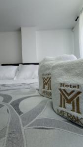 Hotel Meraki Popayán房間的床