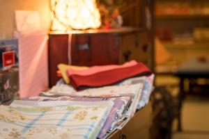 a pile of pillows sitting on top of a table at Iwayu in Misasa