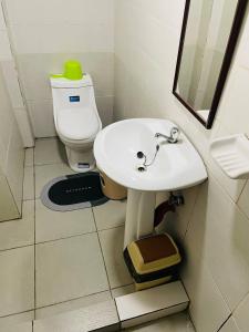 a bathroom with a white sink and a toilet at O Boutique Hotel (Free Breakfast) in Tagaytay