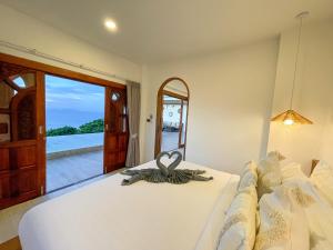 Ein Bett oder Betten in einem Zimmer der Unterkunft High Life Villas
