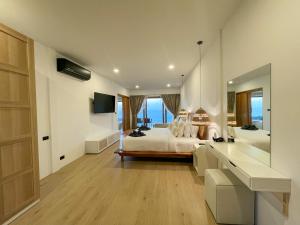 Ein Bett oder Betten in einem Zimmer der Unterkunft High Life Villas
