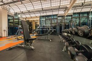 a gym with several rows of exercise bikes at Scarletz Suites by Edenzpace @ KLCC Area in Kuala Lumpur