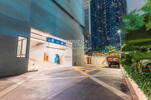 a sidewalk in a city with a building at Scarletz Suites by Edenzpace @ KLCC Area in Kuala Lumpur