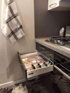 a drawer in a kitchen next to a stove at La Rovettina in Verolanuova