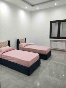 Cama o camas de una habitación en Appartamento di lusso in Tunisia