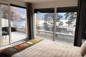 Postel nebo postele na pokoji v ubytování Lakeview Paradise - Residence du National