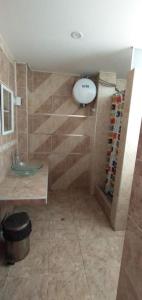 a bathroom with a shower with a sink and a toilet at Huanchaco Paradise Hotel in Huanchaco