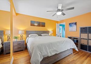 a bedroom with a bed and a ceiling fan at Charming 3 Bedroom House in a Quiet Neighborhood in Columbus