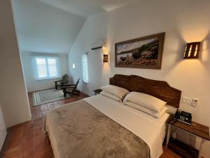 a bedroom with a large bed in a room at OceanBlue Resort in Christ Church