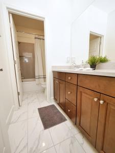 a bathroom with a sink and a toilet at Luxury 3 Bedroom House Near Sacramento Airport in Sacramento