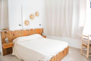 Postel nebo postele na pokoji v ubytování Hostal Mamà Mambò - Zona Colonial