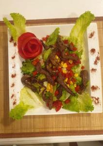 a plate of food with vegetables on a table at ÇARŞI HOTEL&CAFE in Trabzon