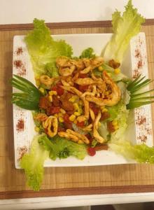 a plate of food with lettuce and shrimp on it at ÇARŞI HOTEL&CAFE in Trabzon
