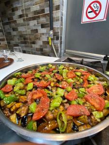a pan of food on top of a stove at ÇARŞI HOTEL&CAFE in Trabzon