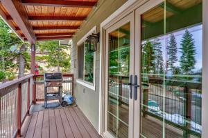 a front porch with glass doors and a grill at Devonshire - Aberdeen in Yosemite West