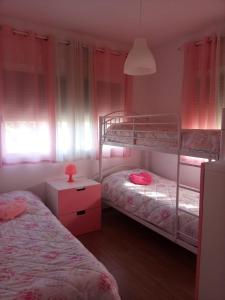 Krevet ili kreveti na kat u jedinici u objektu Chalet Urbanización Alcolea