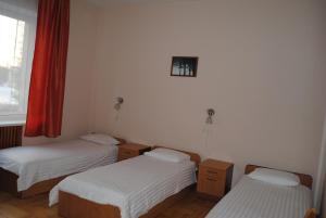 Postel nebo postele na pokoji v ubytování Daugavkrasti Hotel