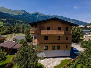 an apartment building with a view of the mountains at Villa Felding top 1 in Bad Hofgastein
