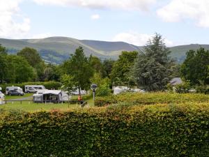 a view of a camping site with mountains in the background at Brynich Villa in Brecon