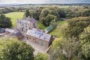 an aerial view of an old house in a field at The Coach House in Blaenporth