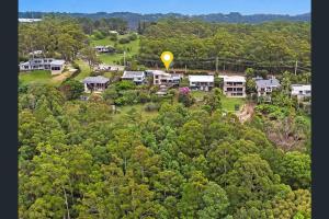 an aerial view of a house with a yellow balloon at Coastline: Alpine Villa in Mount Tamborine