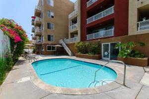 a swimming pool in the courtyard of a apartment building at Sunset Strip 2 Bedroom 2 Bathroom with Pool & Views in Los Angeles