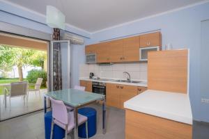 A kitchen or kitchenette at Lefkothea Apartments