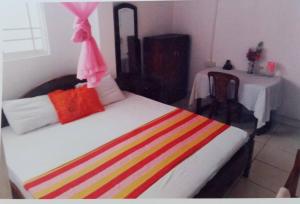 Letto o letti in una camera di Jayanthi Surf Dreams