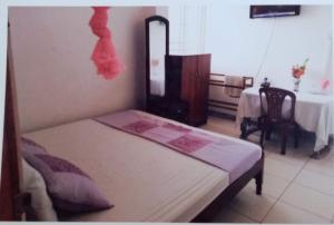 Letto o letti in una camera di Jayanthi Surf Dreams