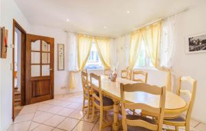 a dining room with a table and chairs at Maison Des Rêves in Saint-Cézaire-sur-Siagne