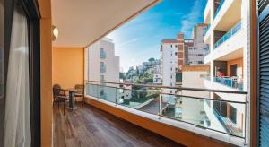 a balcony with a view of a city at Parrot’s House in Lloret de Mar