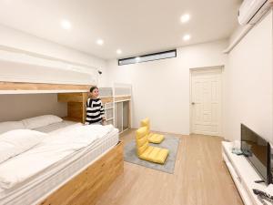 Ein Bett oder Betten in einem Zimmer der Unterkunft Paknap Hostel