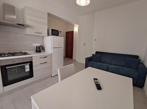 Køkken eller tekøkken på Oasi - By Ligooria