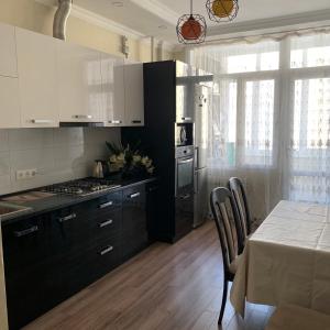 A kitchen or kitchenette at Apartment elit Bishkek