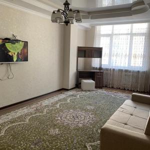 A television and/or entertainment centre at Apartment elit Bishkek