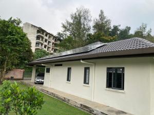 a house with a solar roof on top of it at Ode to Joy in Serendah