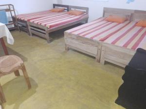 Letto o letti in una camera di Jayanthi Surf Dreams