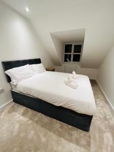 a bedroom with a large bed in a attic at Berkshire stays in Birmingham