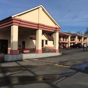 an empty parking lot in front of a building at Scottish Inn - Nashville in Nashville