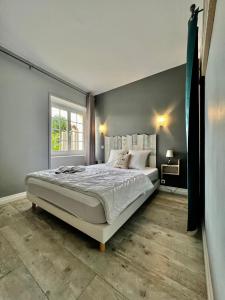 Giường trong phòng chung tại La Rose Des Vents