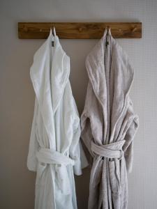 a group of towels hanging on a wall at Lovely, bright apartment overlooking nature in Fiskebäckskil