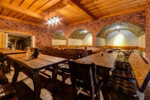 a large room with wooden tables and chairs at Privat Bohemia in Šatov