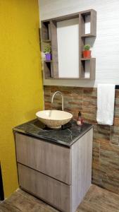 a bathroom with a sink on top of a counter at La Colina - Potrero de los Funes in Potrero de los Funes