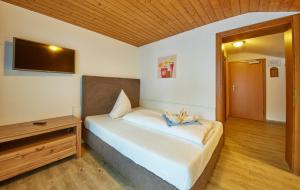 Łóżko lub łóżka w pokoju w obiekcie Hotel Gamshag